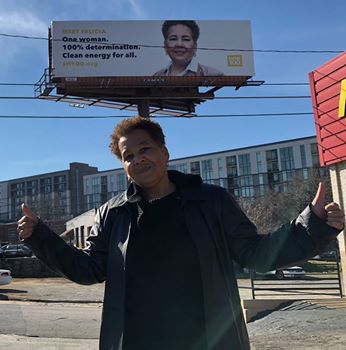 Davis in front of billboard honoring her.
